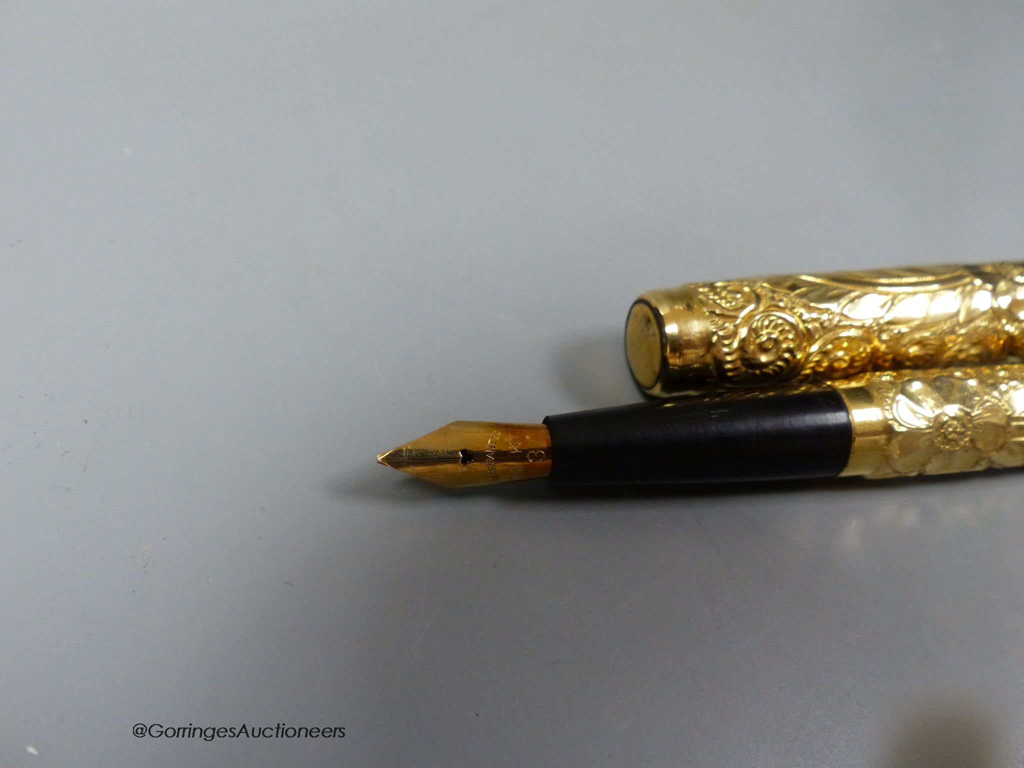 A 1920's gold plated eye-dropper fountain pen
